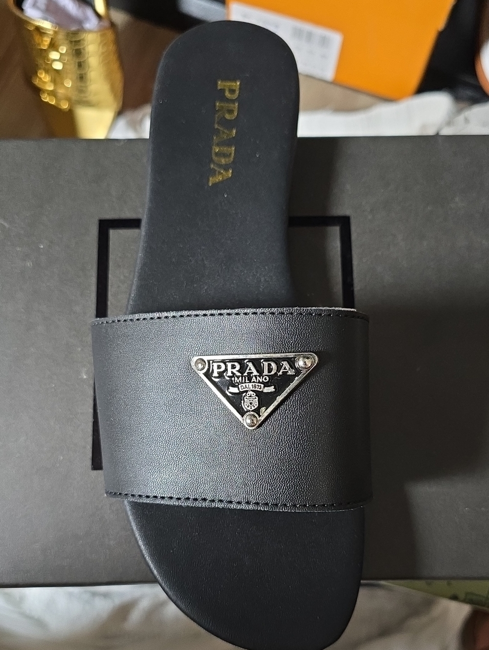 Prada Black Leather Logo Slide Sandal with Silver Triangle Plaque